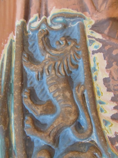 2.1.13 Tea Room Fireplace Tile, Batchelder, Iowa State University, Ames.  View of glazed ceramic lion figure after removal of thick over paint.