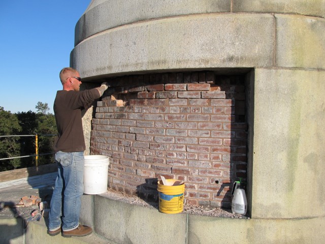 2.5.10 Resetting loose brick and pointing  the brick core.