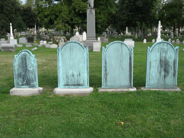 3.1.5 Albright Family gravemarkers, 1874-1931, Forest Lawn Cemetery, Buffalo, NY.  Overview of the bronze markers.