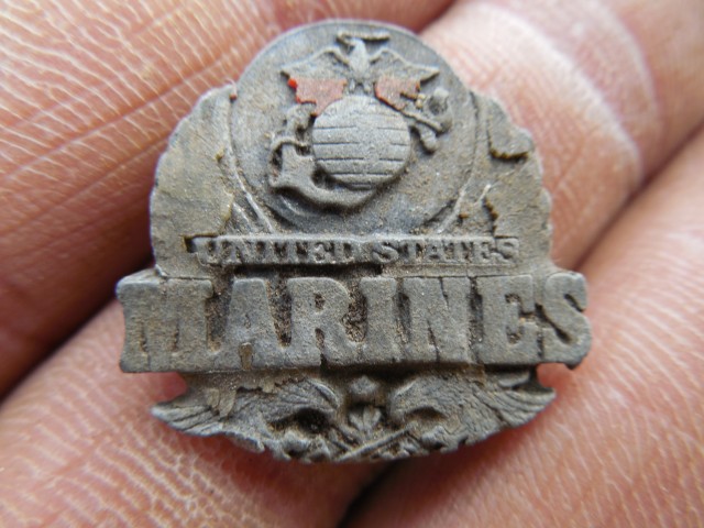 9.5.15  National Iwo Jima Memorial, Petrovics, 1995, New Britain, CT. Insignia found in stones.