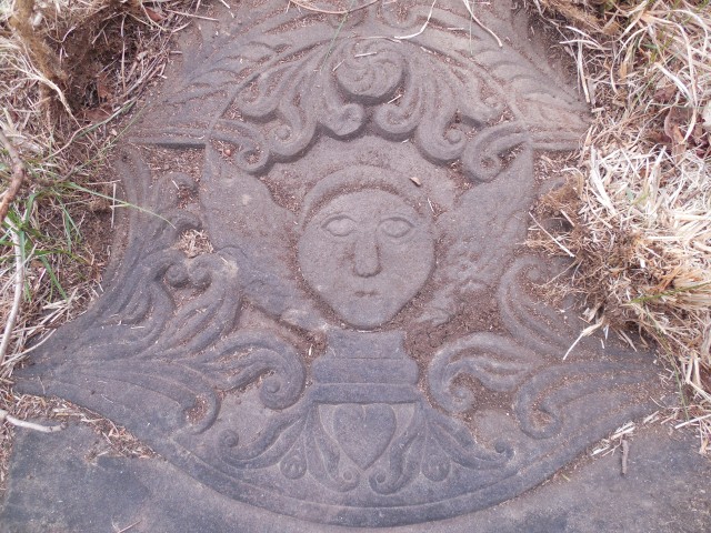 9.15.12 Abigail Miller, 1793, Old North Buying Ground, Middlefield.  Detail of carving of fallen marker being slowly buried in ground